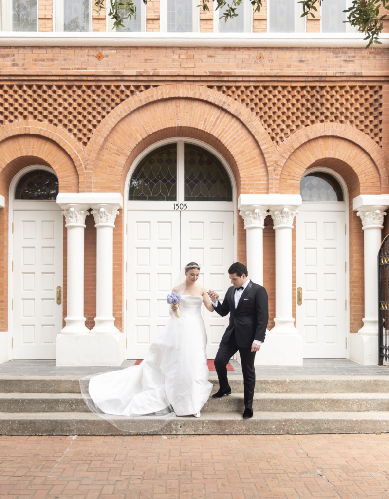 The newlyweds depart St. Joseph Catholic Church for a police escort to the reception in Memorial parik.  (Photo by John Cain)